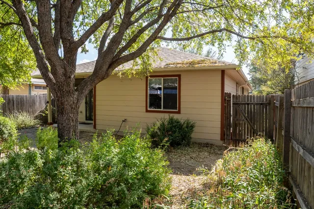 a backyard of a house with lots of green space