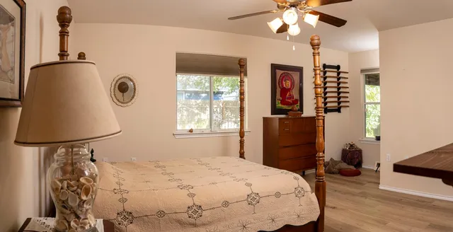 a bedroom with a bed and a dresser