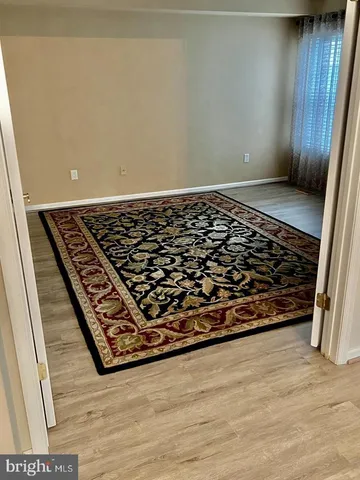 an empty room with wooden floor