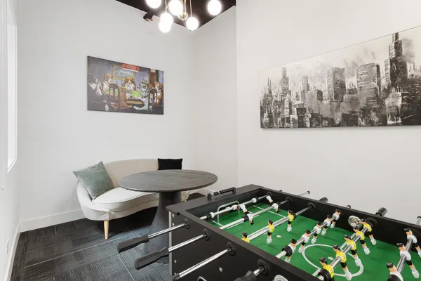 a room with a table and chairs