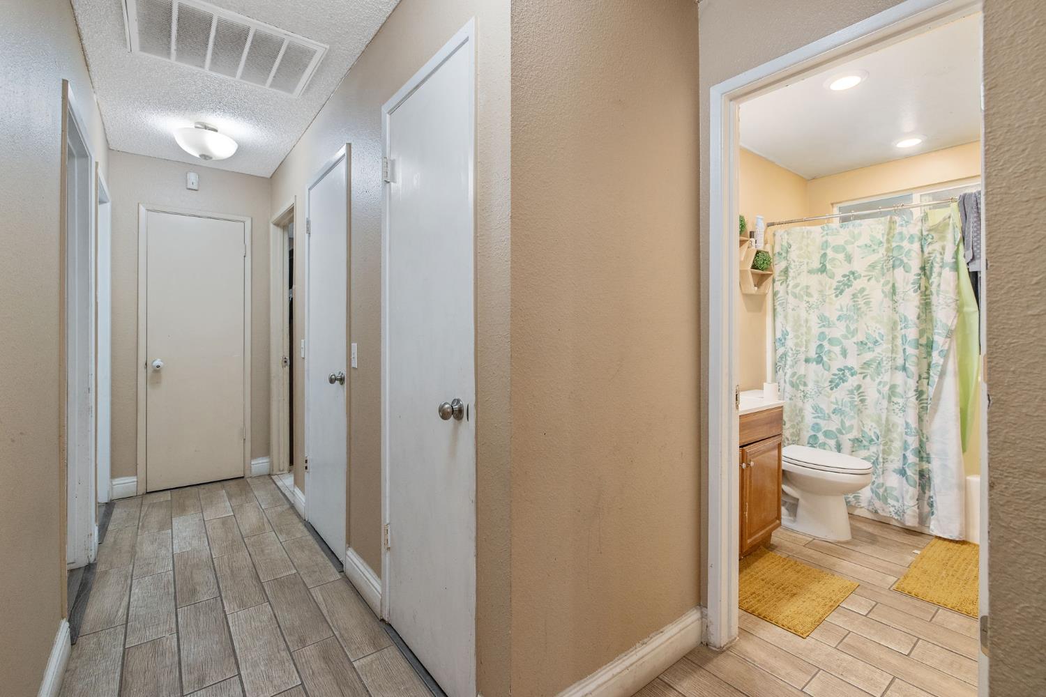 105 West Clark Street Madera, CA 93638 - Photo 21 of 33 a bathroom with a sink and a toilet
