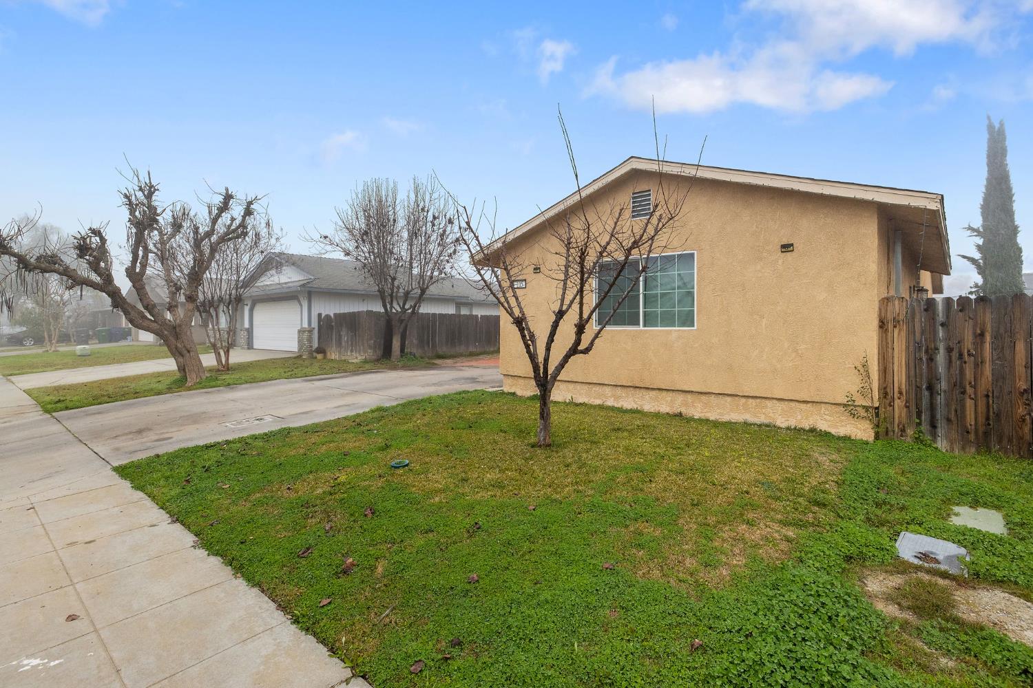 105 West Clark Street Madera, CA 93638 - Photo 3 of 33 a view of a backyard of the house