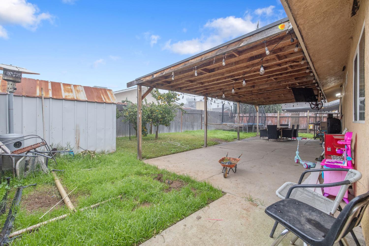 105 West Clark Street Madera, CA 93638 - Photo 33 of 33 a view of a backyard with sitting area