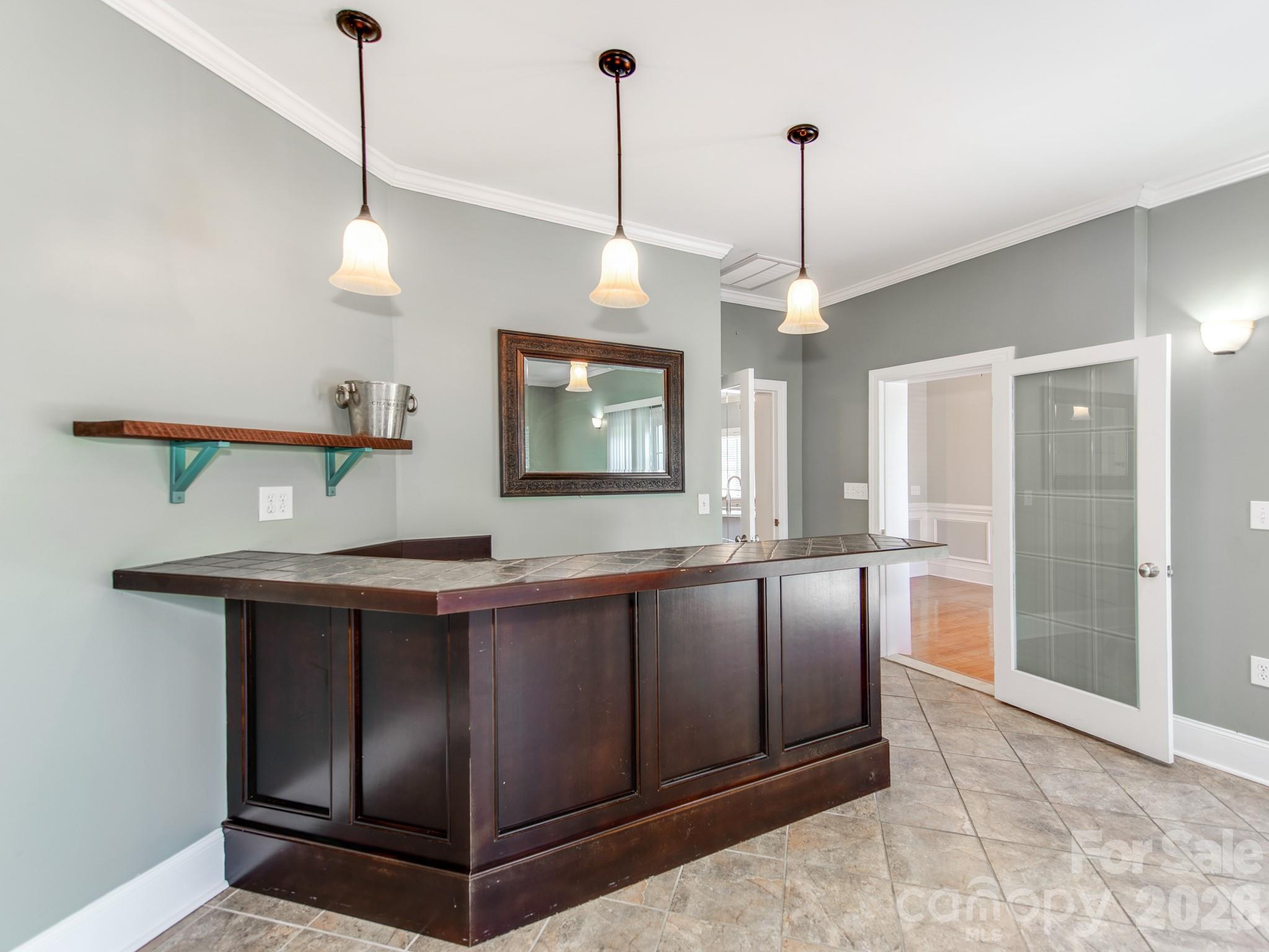 783 Sloan Street Denver, NC 28037 - Photo 12 of 44 a view of a kitchen with a sink and wooden floor
