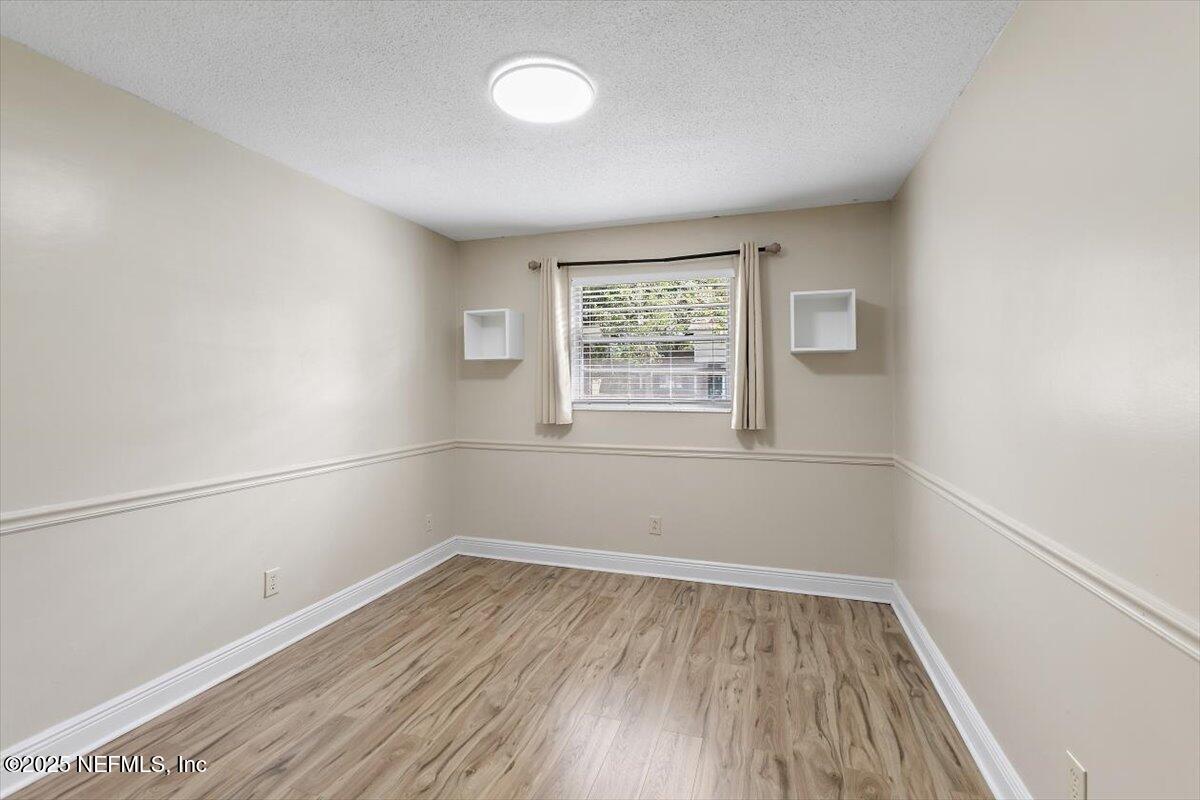8408 Brierwood Road Jacksonville, FL 32217 - Photo 14 of 25 an empty room with a window