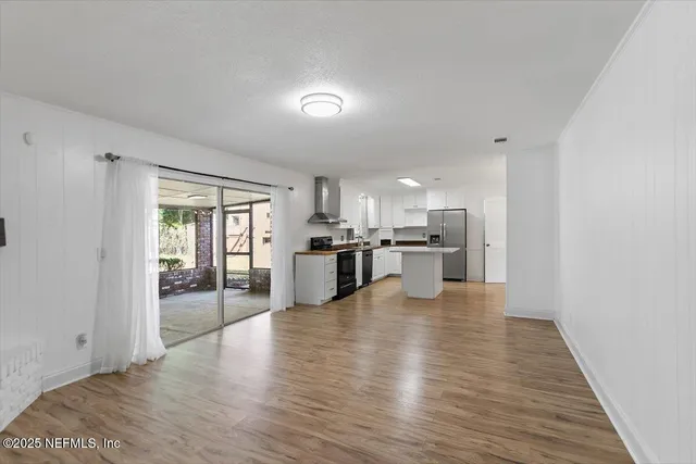 a view of kitchen with wooden floor