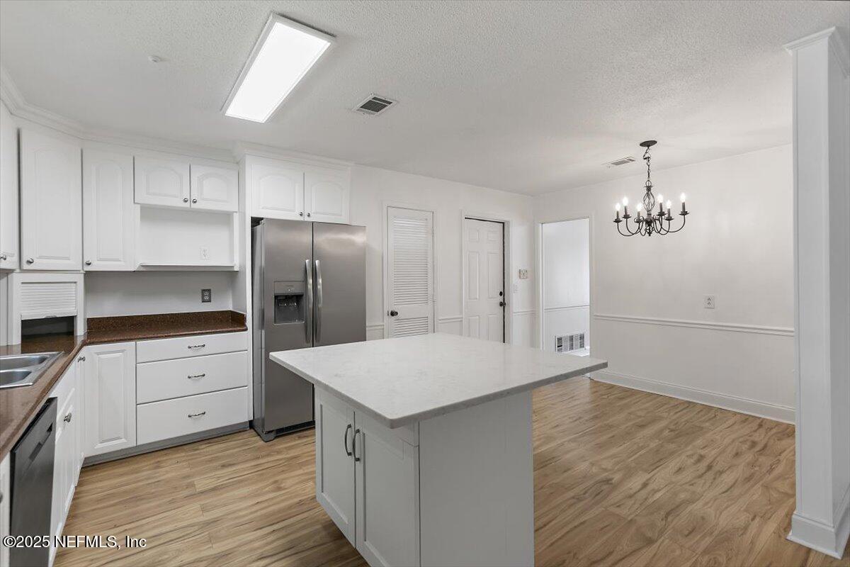 8408 Brierwood Road Jacksonville, FL 32217 - Photo 9 of 25 a kitchen with a refrigerator a sink and dishwasher