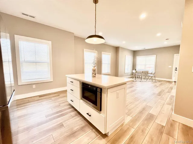 a kitchen with stainless steel appliances a stove top oven and sink