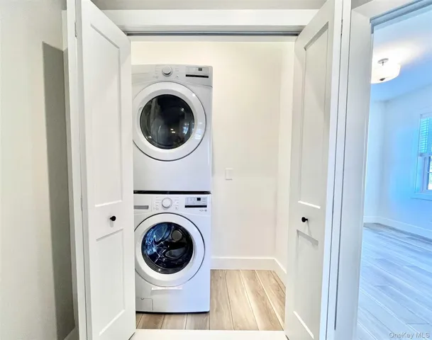 a view of a hallway with washer and dryer