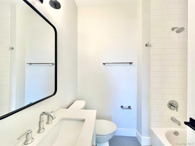 a bathroom with a sink and toilet