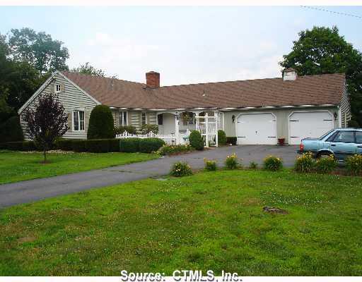 121 Scantic Road East Windsor, CT 06088 - Photo 1 of 1 a front view of house with yard and green space