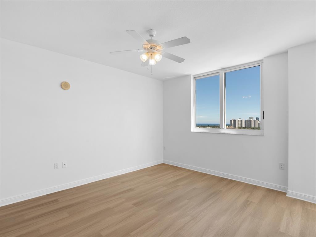 1745 East Hallandale Beach Boulevard, Unit 2007W Hallandale Beach, FL 33009 - Photo 13 of 16 a view of an empty room with wooden floor