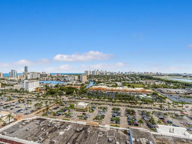 an empty room with floor to ceiling windows and walls