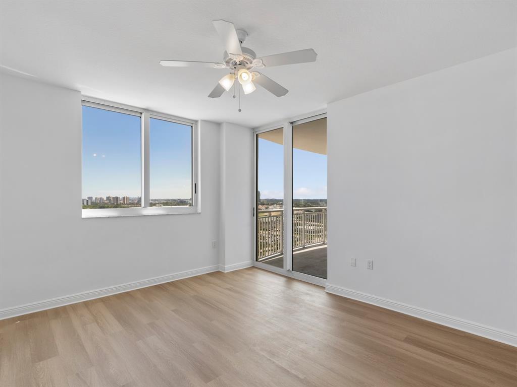 1745 East Hallandale Beach Boulevard, Unit 2007W Hallandale Beach, FL 33009 - Photo 7 of 16 wooden floor in an empty room with a window
