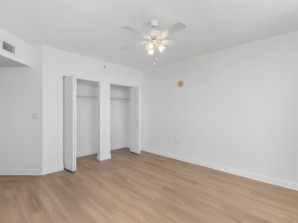 1745 East Hallandale Beach Boulevard, Unit 2007W Hallandale Beach, FL 33009 - Photo 9 of 16 a view of an empty room with wooden floor