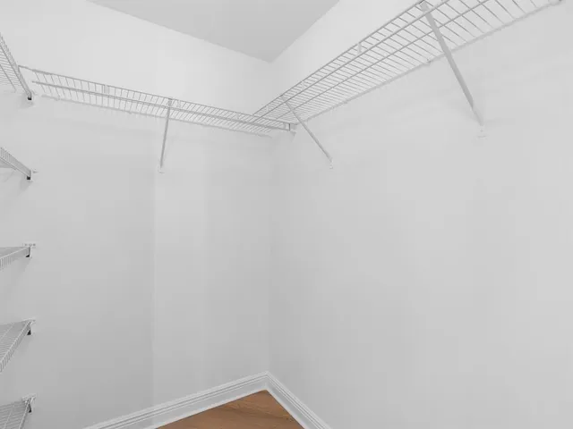 a bathroom with a shower a toilet and a sink