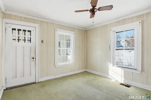 a view of an empty room with a window