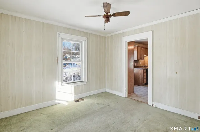 a view of an empty room with a window