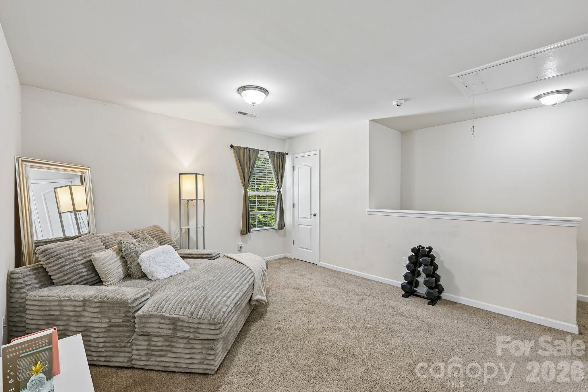 2206 Turtle Point Road Charlotte, NC 28262 - Photo 20 of 28 a spacious bedroom with a bed and a window
