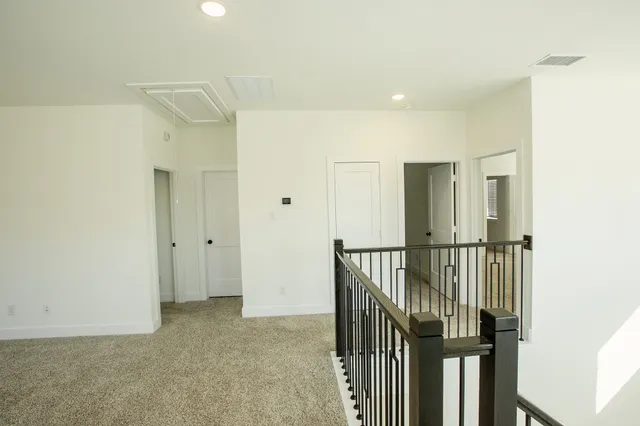 a view of a hallway with staircase