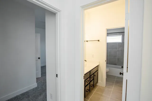 a bathroom with a bathtub and a sink