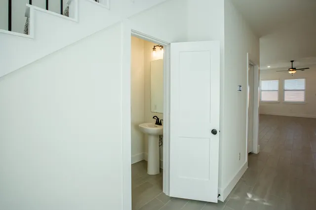 a view of a bathroom from a hallway