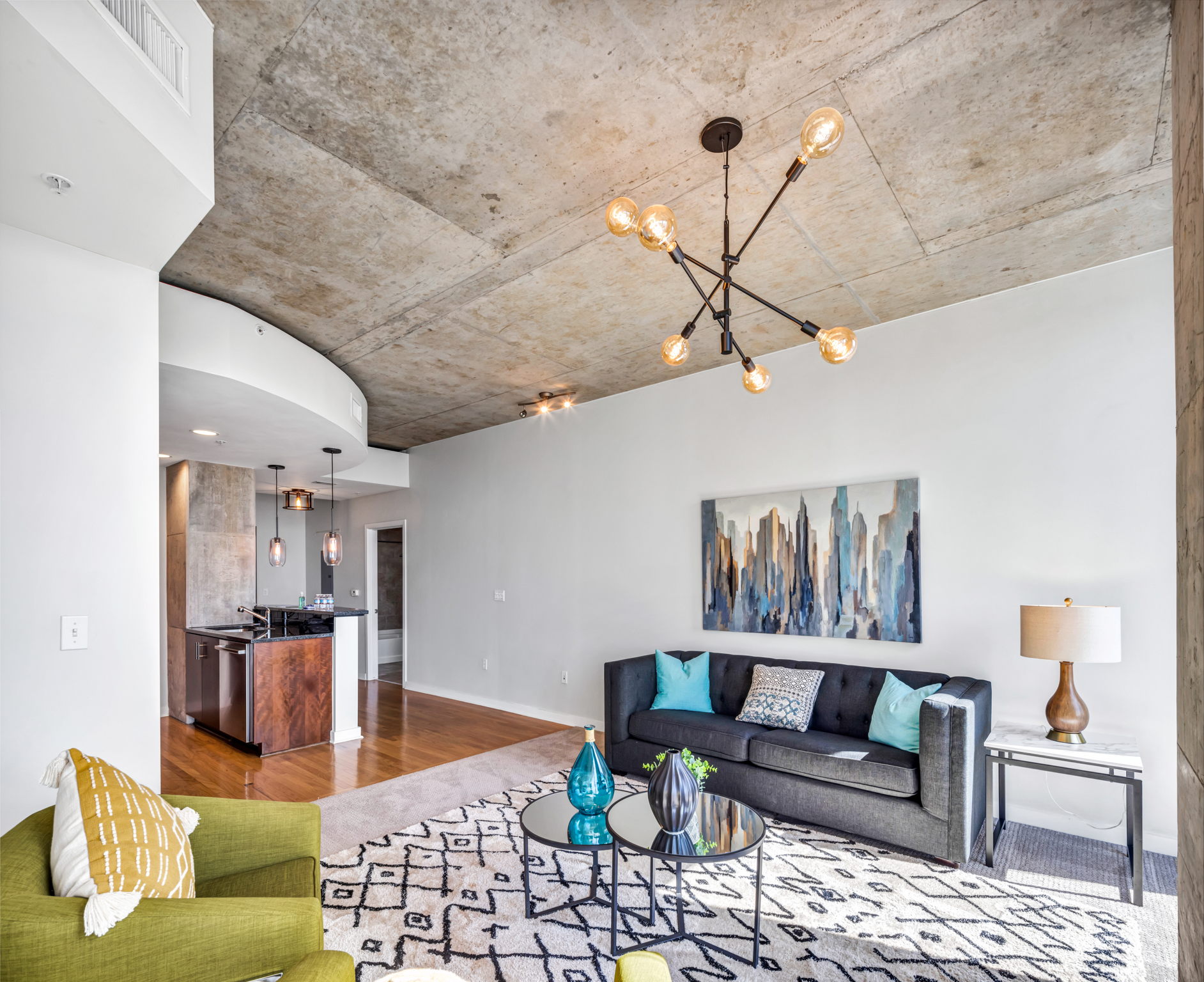 360 Nueces Street, Unit 2906 Austin, TX 78701 - Photo 1 of 1 a living room with furniture and kitchen view