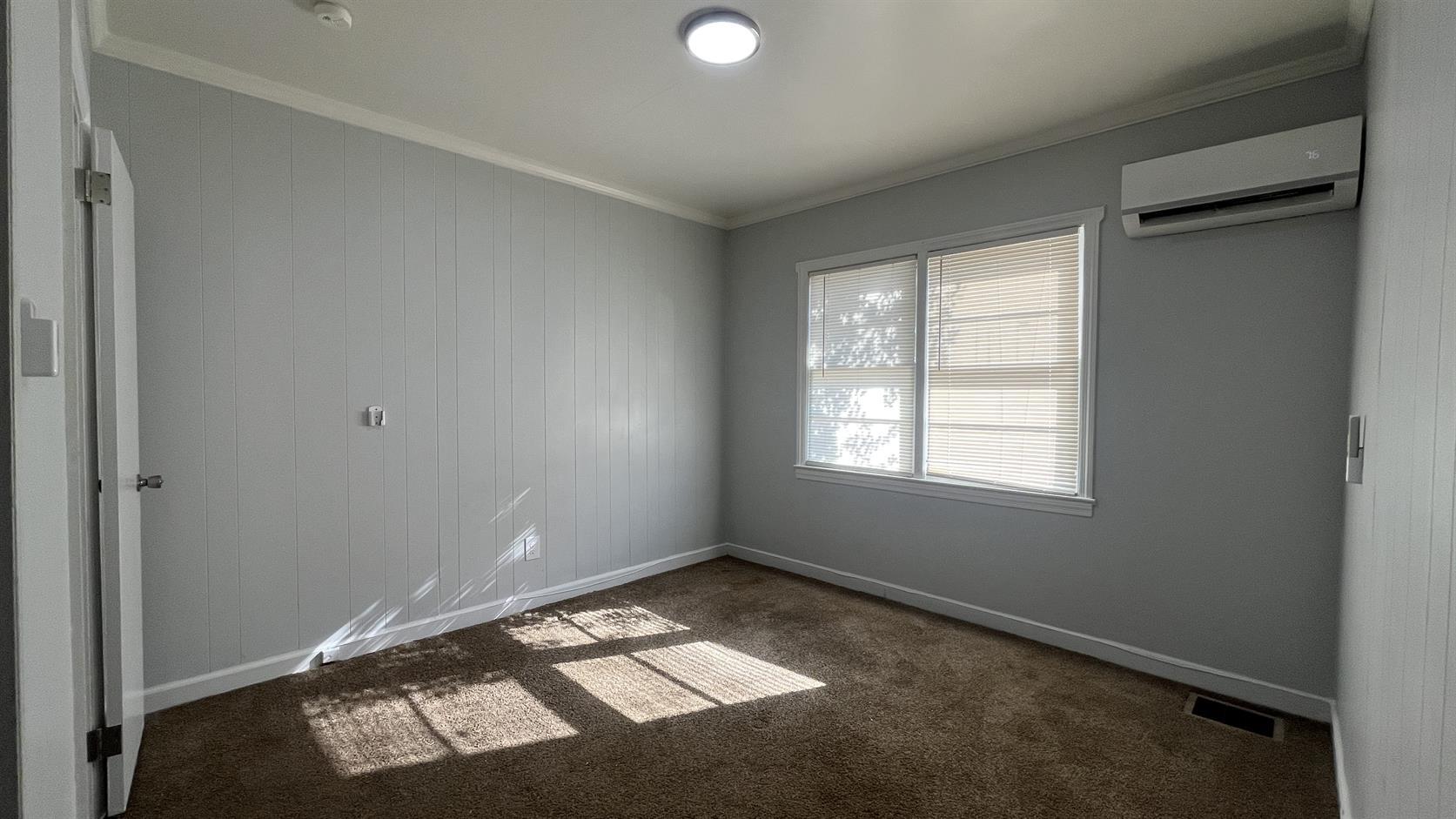 704 Blue Ridge Avenue, Unit 5 Bedford, VA 24523 - Photo 5 of 10 an empty room with windows