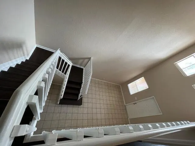 a view of an empty room and wooden floor