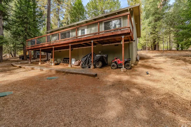a living room with furniture fireplace and a large window