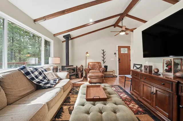 a kitchen with refrigerator and window