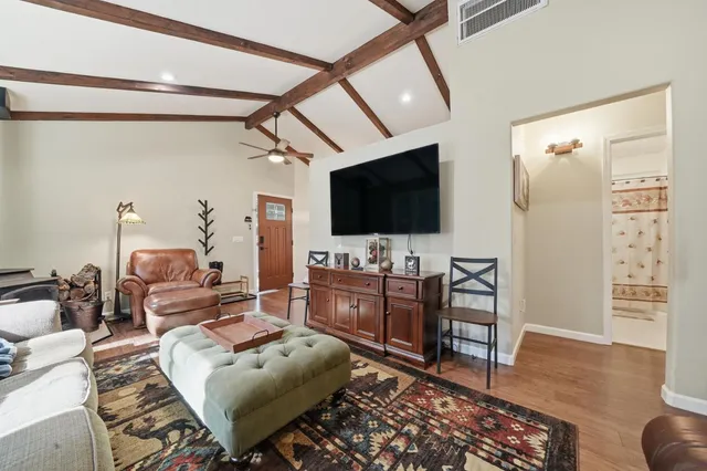 a kitchen with a table chairs stove and microwave