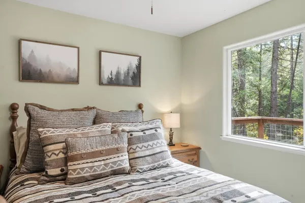 a view of outdoor space with deck and trees