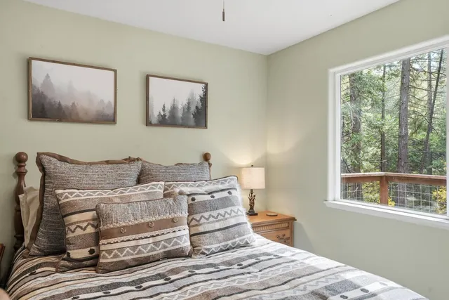 a view of outdoor space with deck and trees