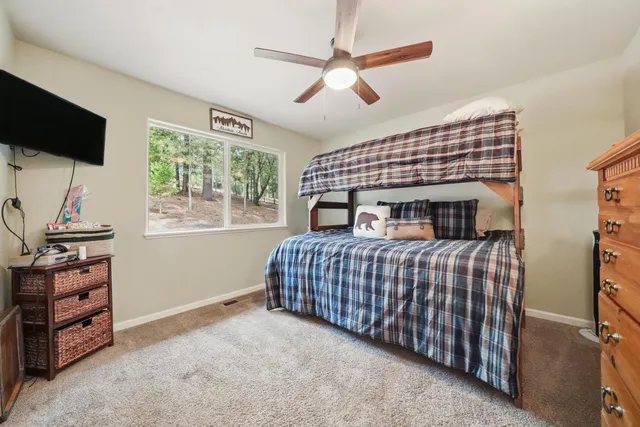 a view of a bench with wooden fence