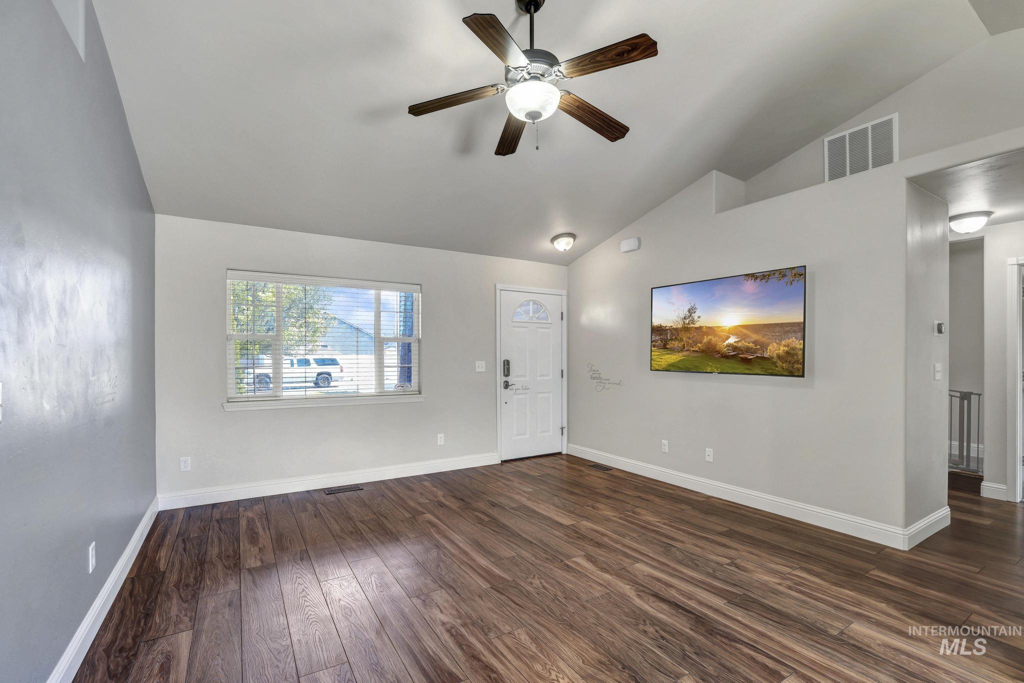 446 Noble Street Twin Falls, ID 83301 - Photo 6 of 42 Vaulted ceilings with a ceiling fan light fixture enhance this living space