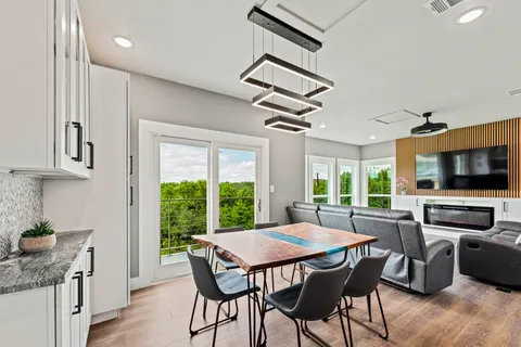 a view of a dining room with furniture window and outside view