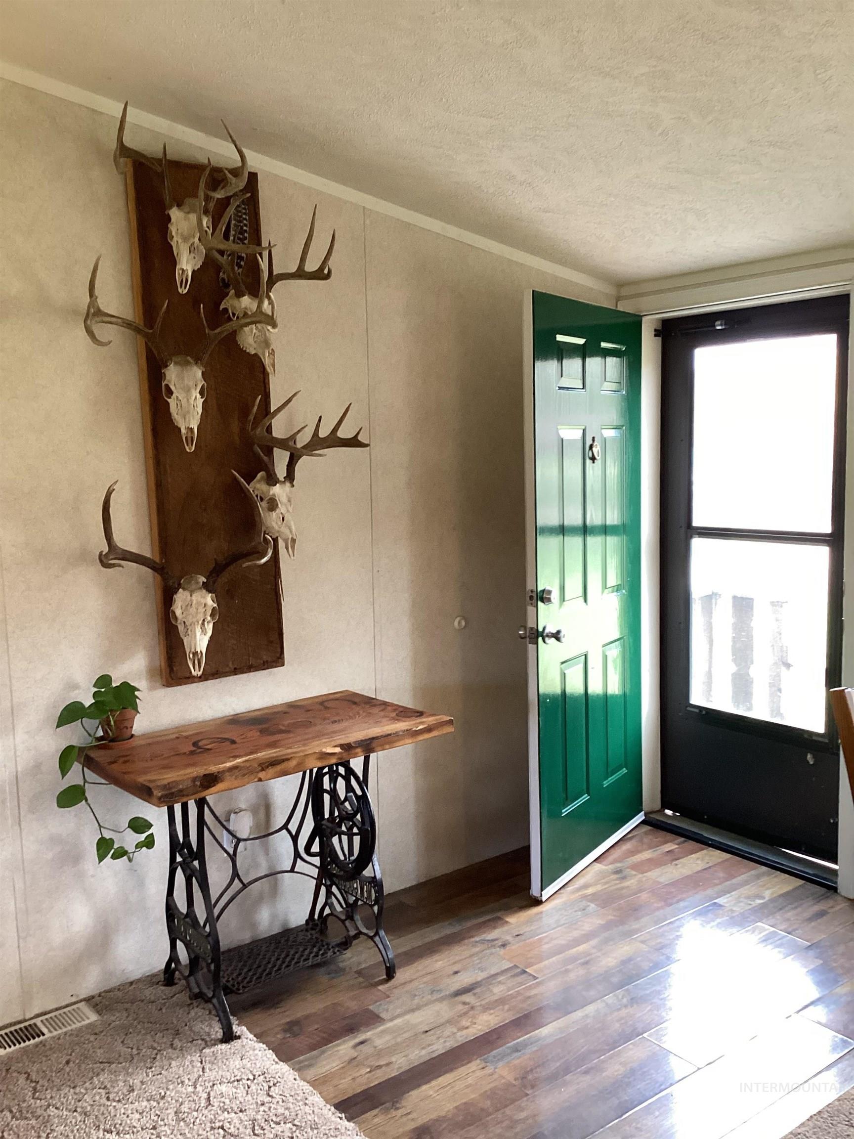2605 West Frk Road Council, ID 83612 - Photo 13 of 34 Entrance foyer featuring hardwood / wood-style floors, a textured ceiling, and ornamental molding
