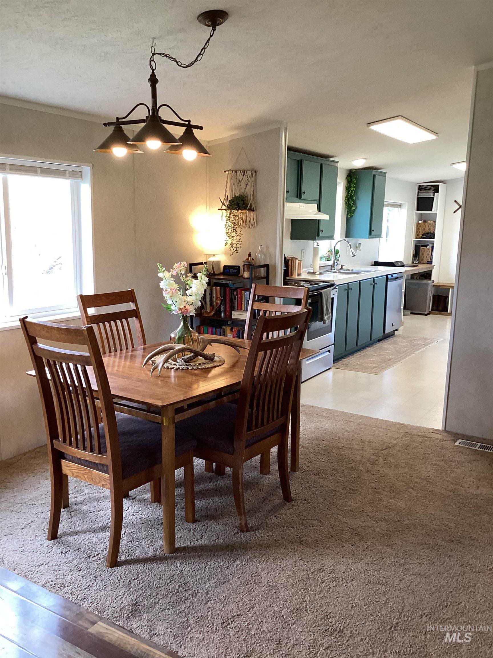 2605 West Frk Road Council, ID 83612 - Photo 17 of 34 Dining area with a textured ceiling and light carpet