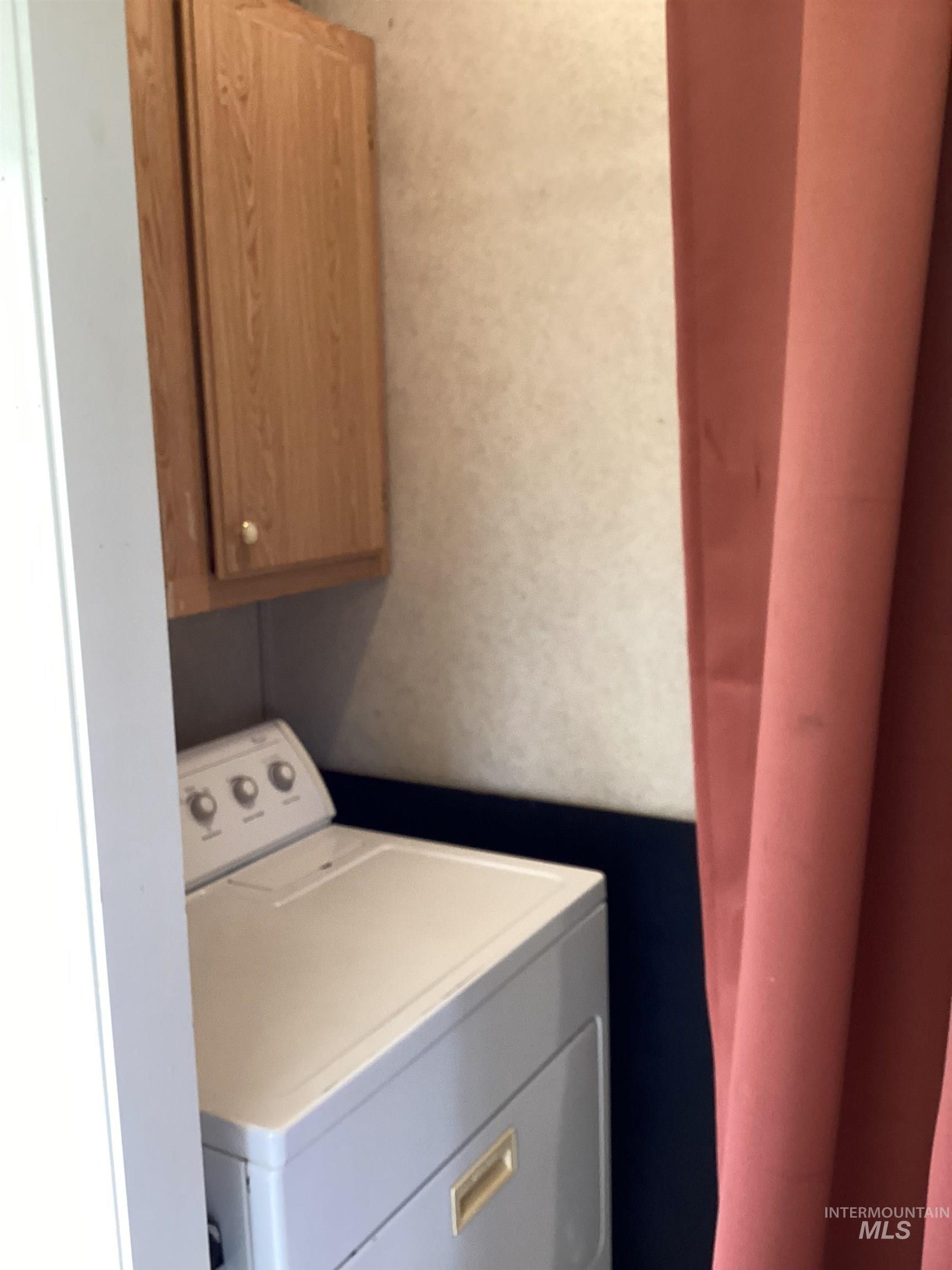 2605 West Frk Road Council, ID 83612 - Photo 22 of 34 Laundry room featuring washer / dryer and cabinet space
