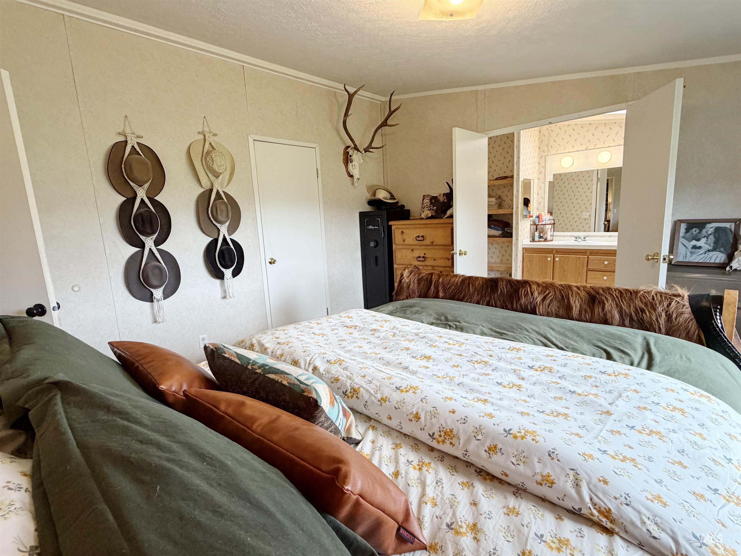 2605 West Frk Road Council, ID 83612 - Photo 25 of 34 Bedroom featuring ornamental molding and a textured ceiling