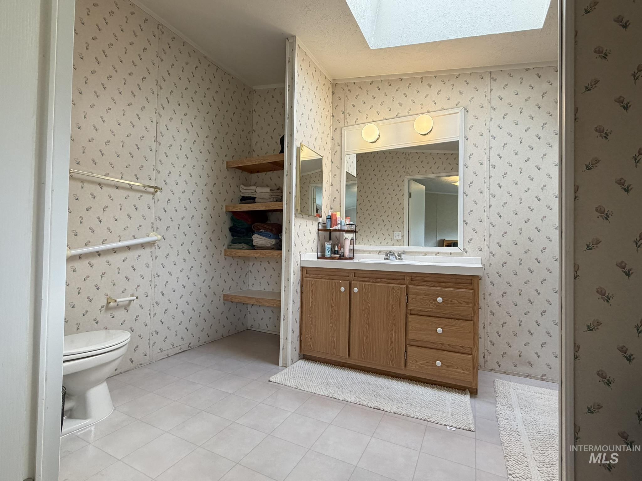 2605 West Frk Road Council, ID 83612 - Photo 27 of 34 Bathroom with vanity, a skylight, and light tile patterned floors