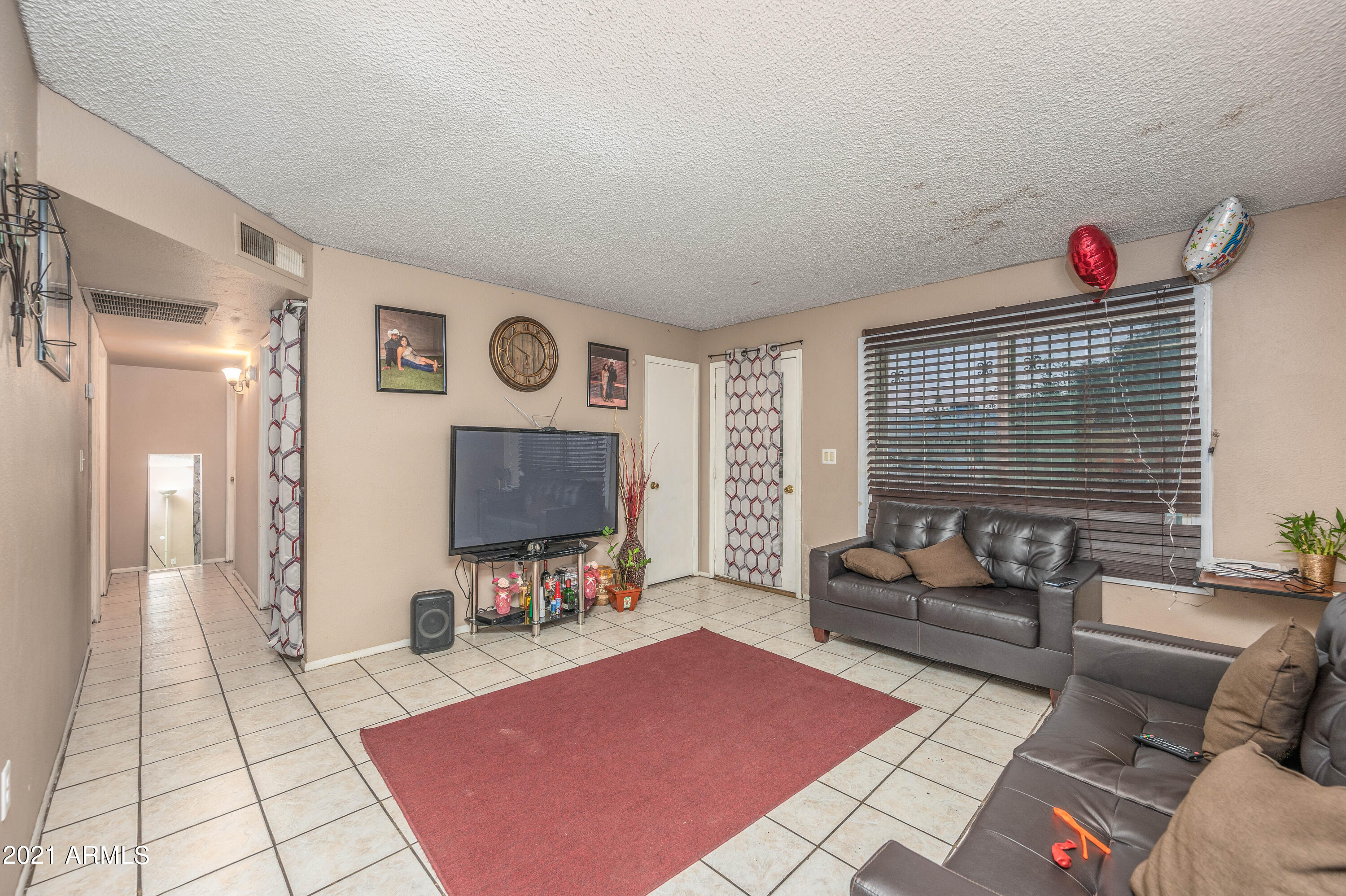 5146 West Berkeley Road Phoenix, AZ 85035 - Photo 19 of 20 a living room with furniture and a flat screen tv