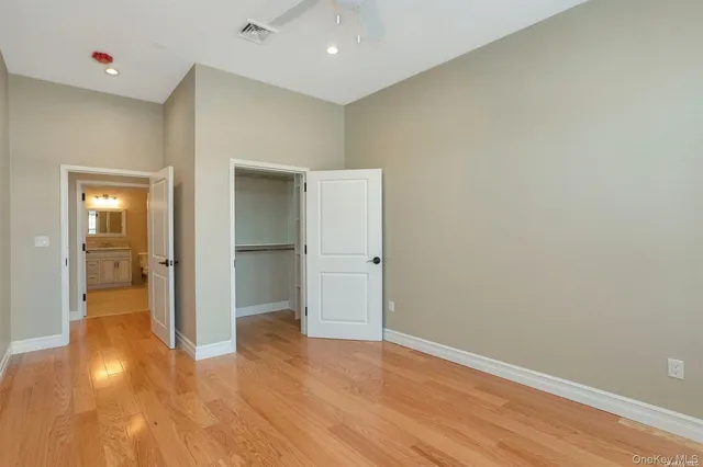 a view of hallway with wooden floor