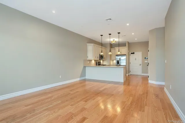 a view of kitchen with wooden floor
