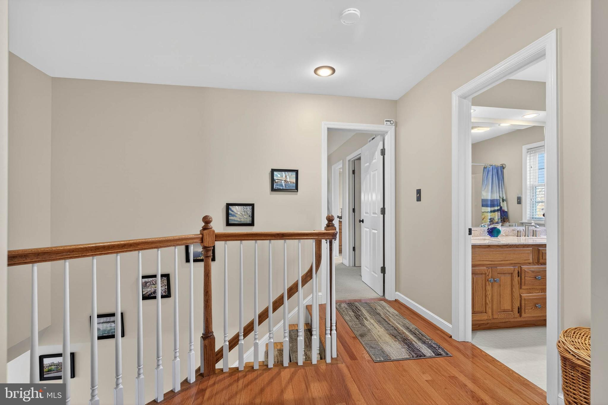 35 Old Post Lane Lititz, PA 17543 - Photo 26 of 61 a view of a hallway with wooden floor and a bathroom