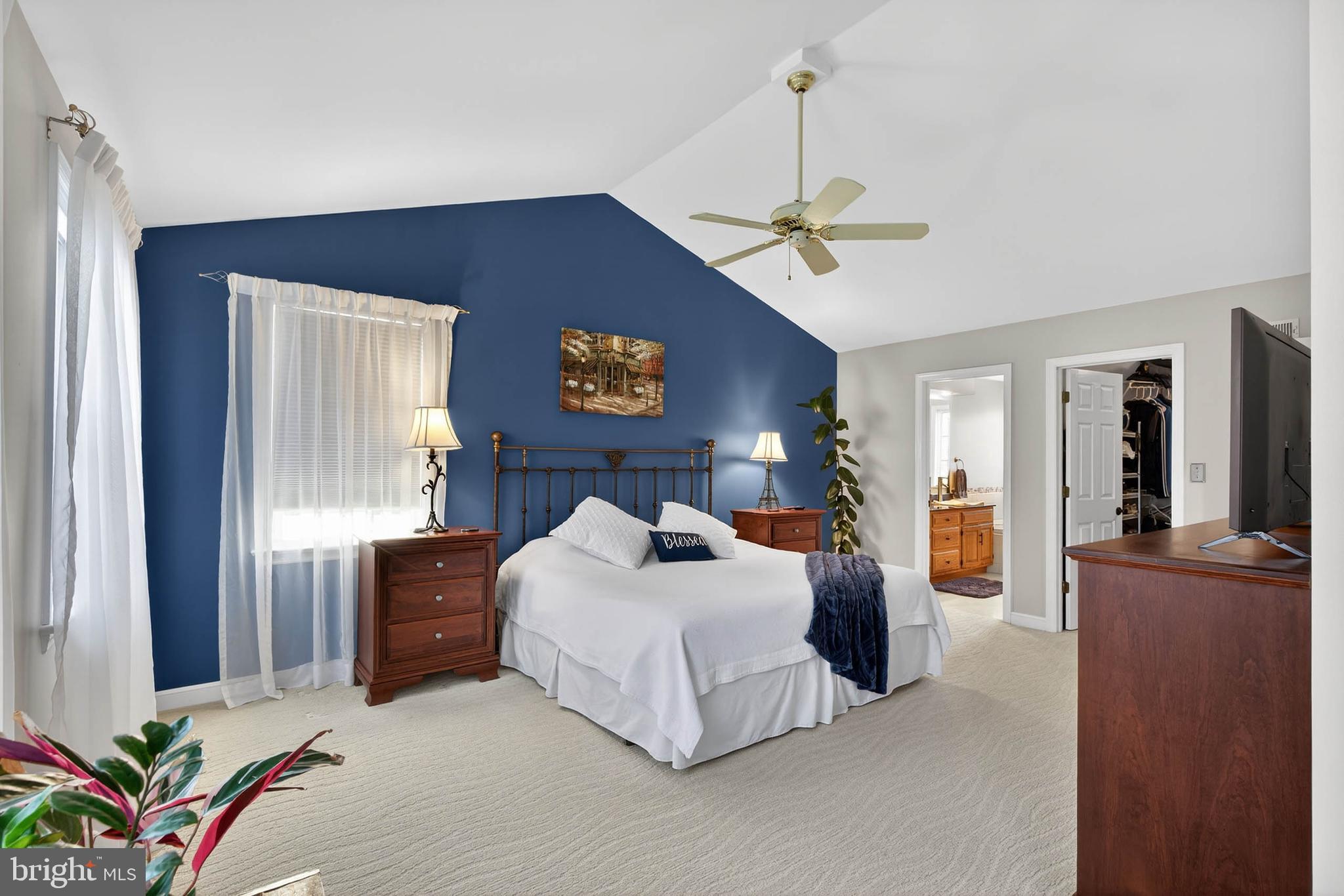 35 Old Post Lane Lititz, PA 17543 - Photo 33 of 61 a bedroom with a large bed and a chandelier