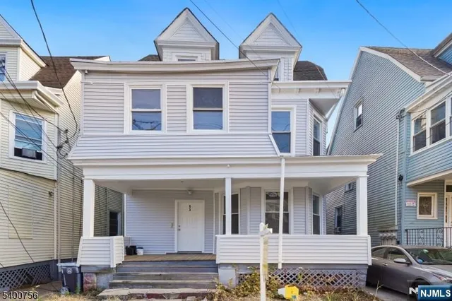 a view of a white building among the street
