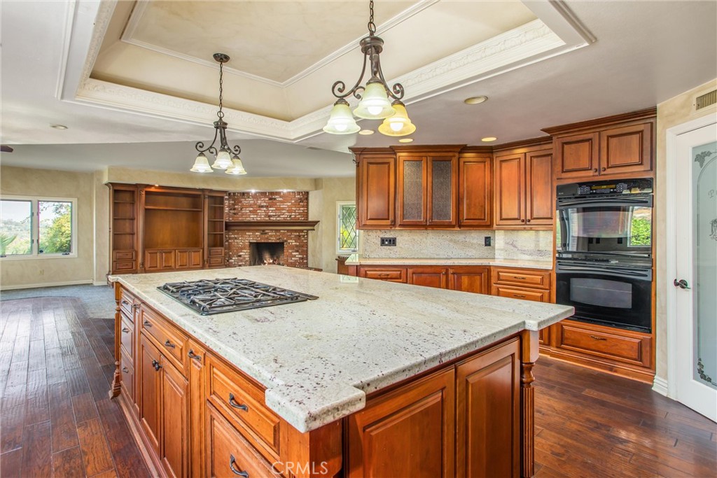 6966 Ranch View Road Riverside, CA 92506 - Photo 11 of 73 a kitchen with stainless steel appliances granite countertop a sink stove and refrigerator