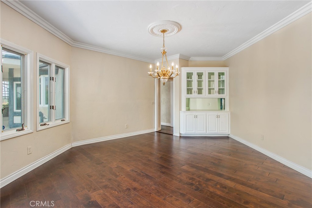 6966 Ranch View Road Riverside, CA 92506 - Photo 15 of 73 a view of an empty room with a window and wooden floor